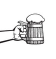 hand holding old wooden mug full beer vector image