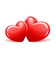 two red glossy hearts vector image