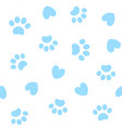 seamless background with paw prints and hearts vector image vector image