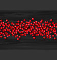christmas holly berry on black wooden vector image vector image
