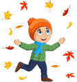 Cartoon happy boy with autumn leaves Royalty Free Vector