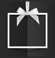 white gift box frame with silky bow on black vector image