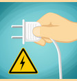 human hand with an electric plug warning sign vector image