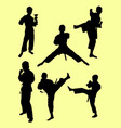 karate kids silhouette vector image