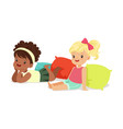 two sweet little girls sitting and lying vector image