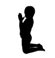 silhouette of a boy who pray vector image