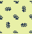 blue paw print icon isolated seamless pattern vector image vector image