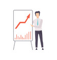 businessman in a suit pointing at a whiteboard vector image