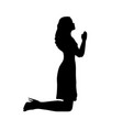 silhouette woman kneeling praying vector image